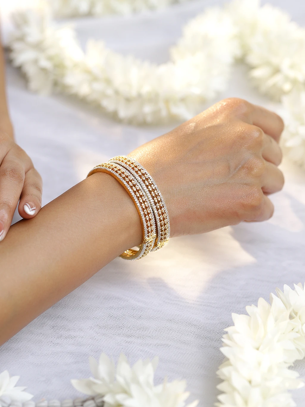 ₹1,414 RUBANS Brass Gold-Plated Bangle Set for Women in India